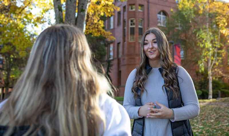 students chat in tiffany loop